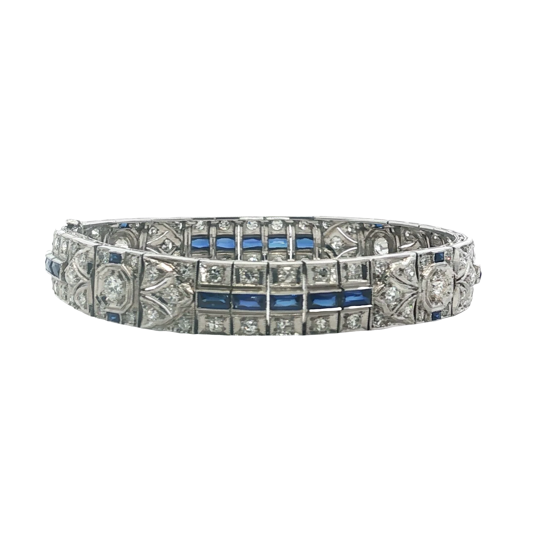 Capture timeless elegance with this platinum tennis bracelet. Featuring deeply saturated blue square-cut sapphires in step cut, contrasted by brilliant round diamonds. Its elaborate art deco design and precision detailing create a sophisticated appeal. A vintage-inspired masterpiece of timeless style, that's perfect for adding a touch of refined sparkle to any attire.