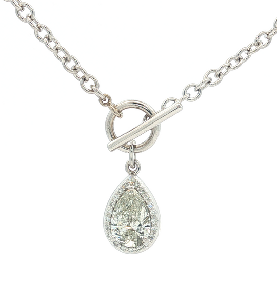 xquisite diamond necklace featuring a brilliant pear-shaped diamond pendant, suspended from a lustrous white gold silver chain. The pendant showcases a timeless design, perfect for adding a touch of elegance to any ensemble. Its composition and arrangement underscore the beauty of diamond.
