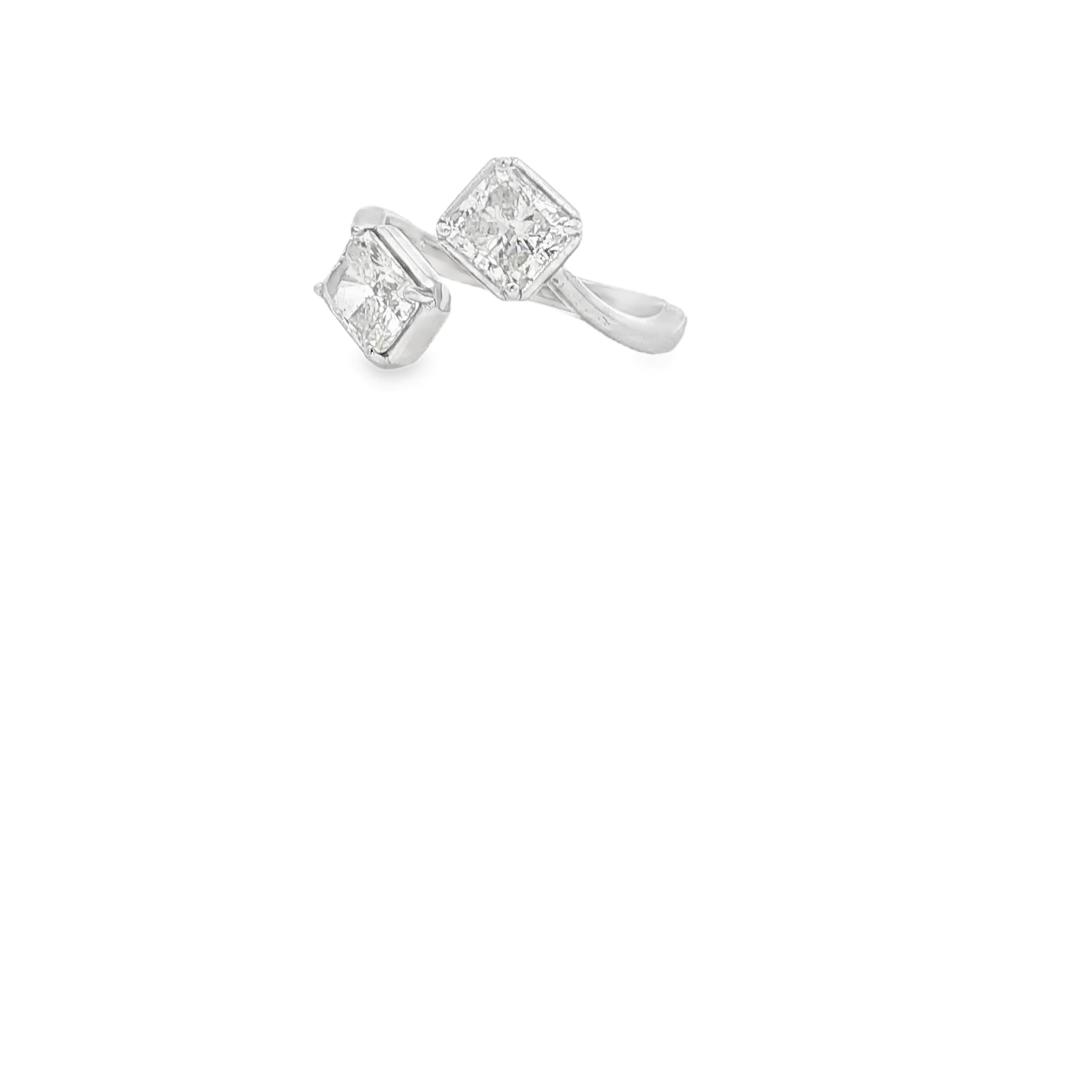 This sophisticated white gold ring features a central princess cut diamond, celebrated for its geometric precision and brilliant cutting style. The main stone is accented by sparkling round diamonds channel-set along the shoulders, creating a seamless stream of radiance. Boasting exceptional clarity and symmetry, this multi-stone arrangement is meticulously polished to enhance the cool tones of the gold, offering a modern and refined aesthetic perfect for special occasions.