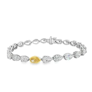 18K White Gold Tennis Bracelet with Pear Cut Fancy Vivid Yellow Diamond.     SKU   2529