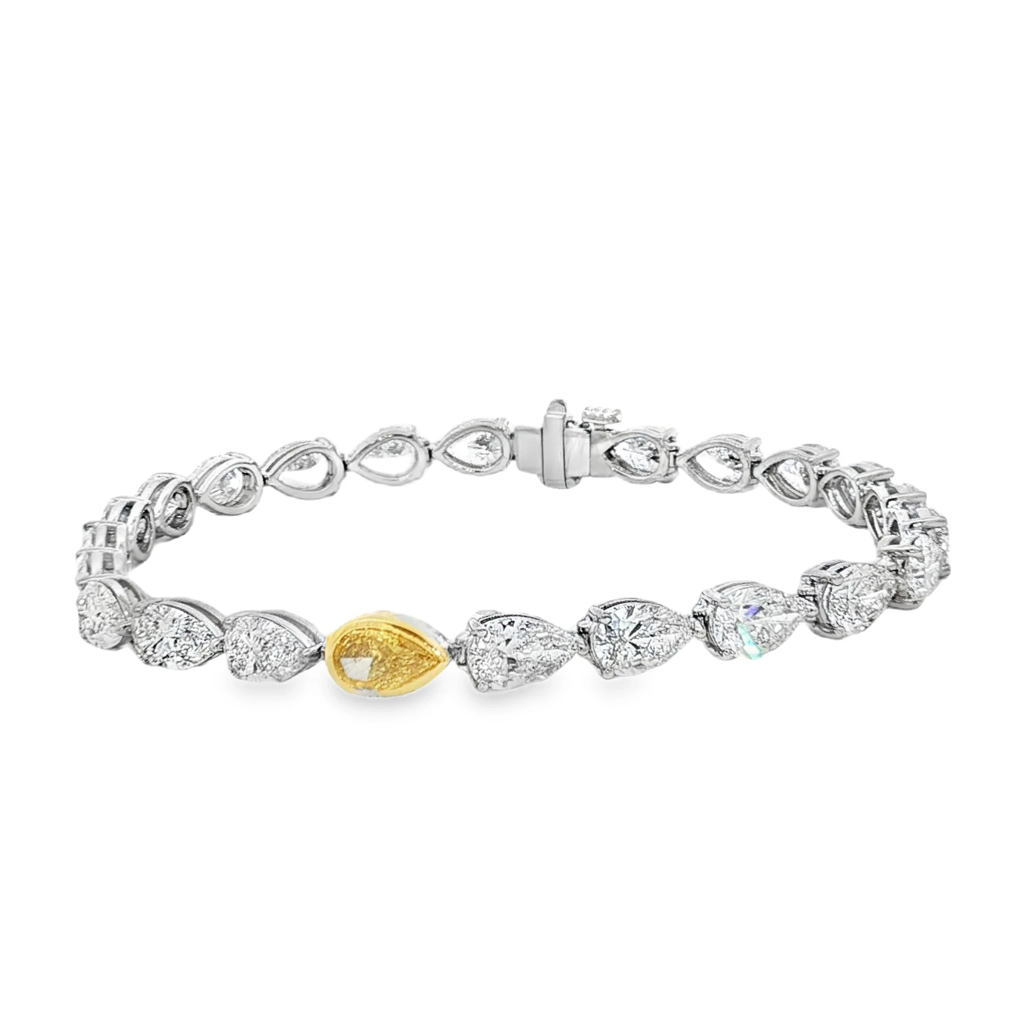 18K White Gold Tennis Bracelet with Pear Cut Fancy Vivid Yellow Diamond. SKU 2529
