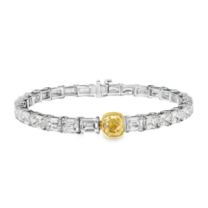 18K White Gold Tennis Bracelet with 29 Emerald Cut Diamonds and a GIA 1.50 Fancy intense Yellow Diamond.   SKU    2535