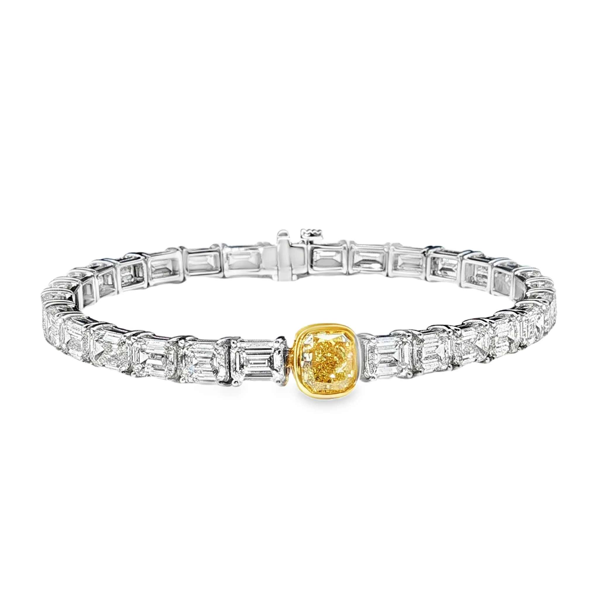 18K White Gold Tennis Bracelet with 29 Emerald Cut Diamonds and a GIA 1.50 Fancy intense Yellow Diamond. SKU 2535
