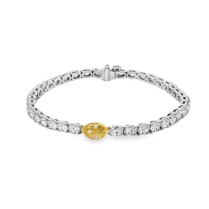White Gold Tennis Bracelet with Round Brilliant Diamonds and a Fancy yellow Oval.     SKU  2674
