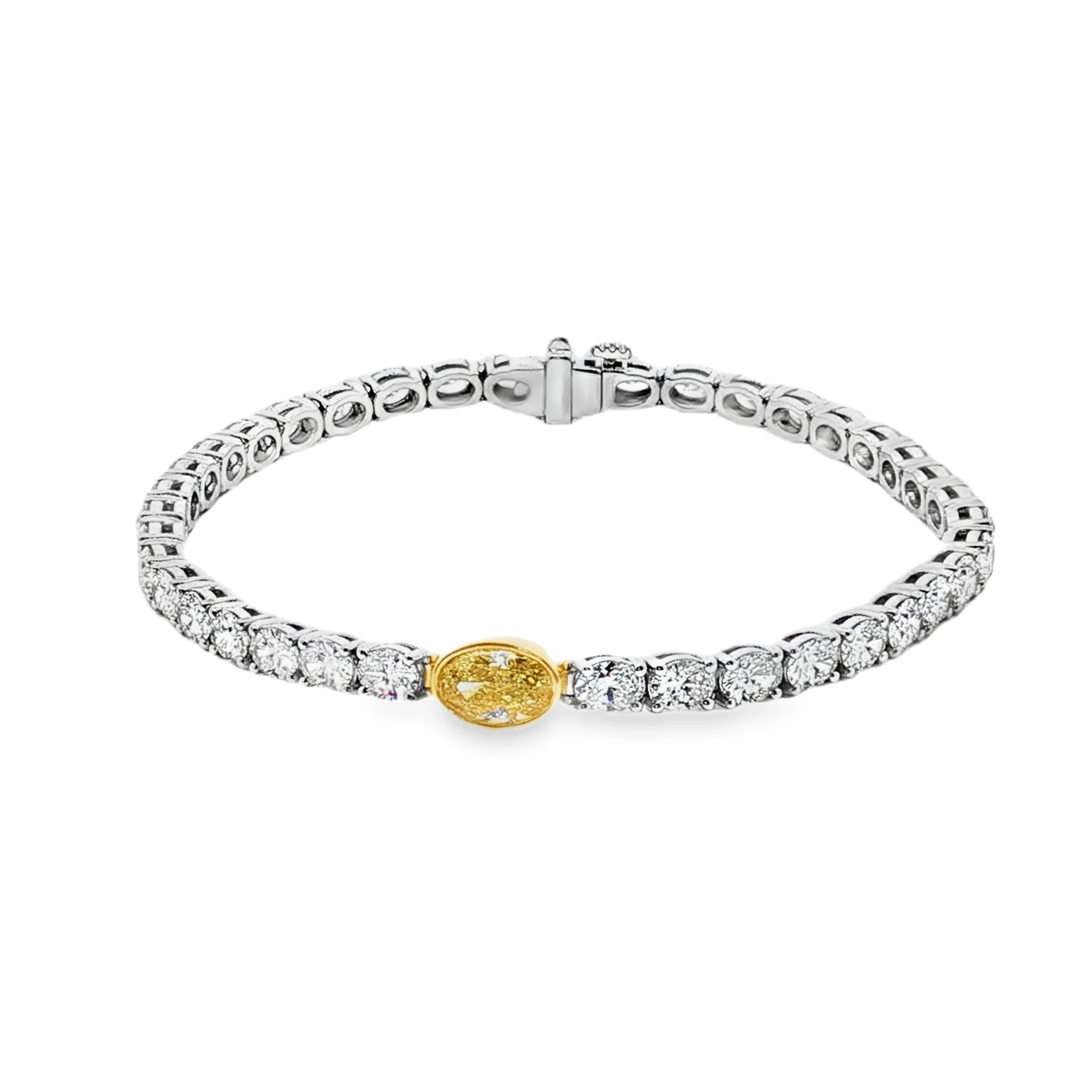 White Gold Tennis Bracelet with Round Brilliant Diamonds and a Fancy yellow Oval. SKU 2674