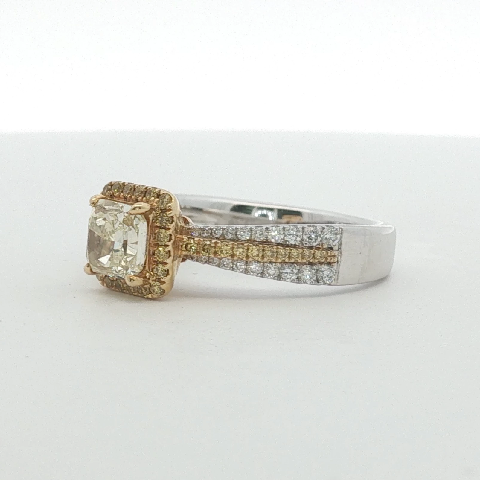 Fancy Light Yellow Diamond Halo Engagement Ring in White Gold