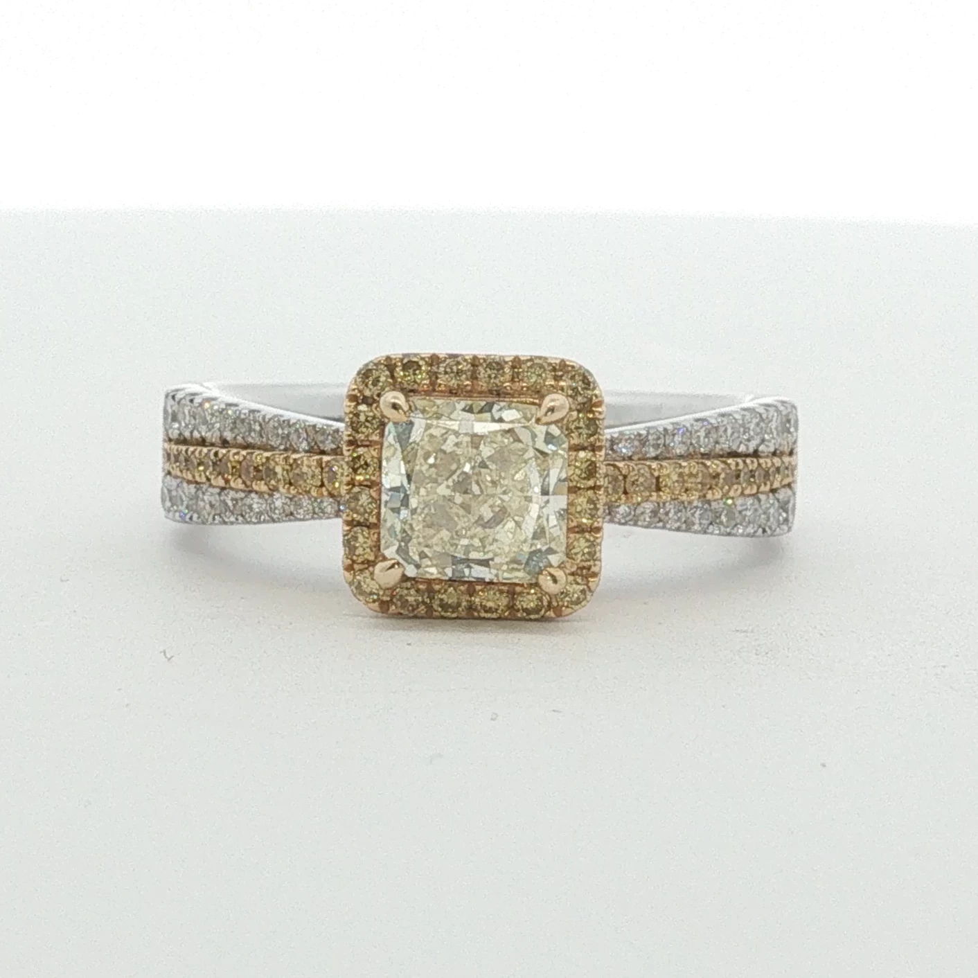 Fancy Light Yellow Diamond Halo Engagement Ring in White Gold